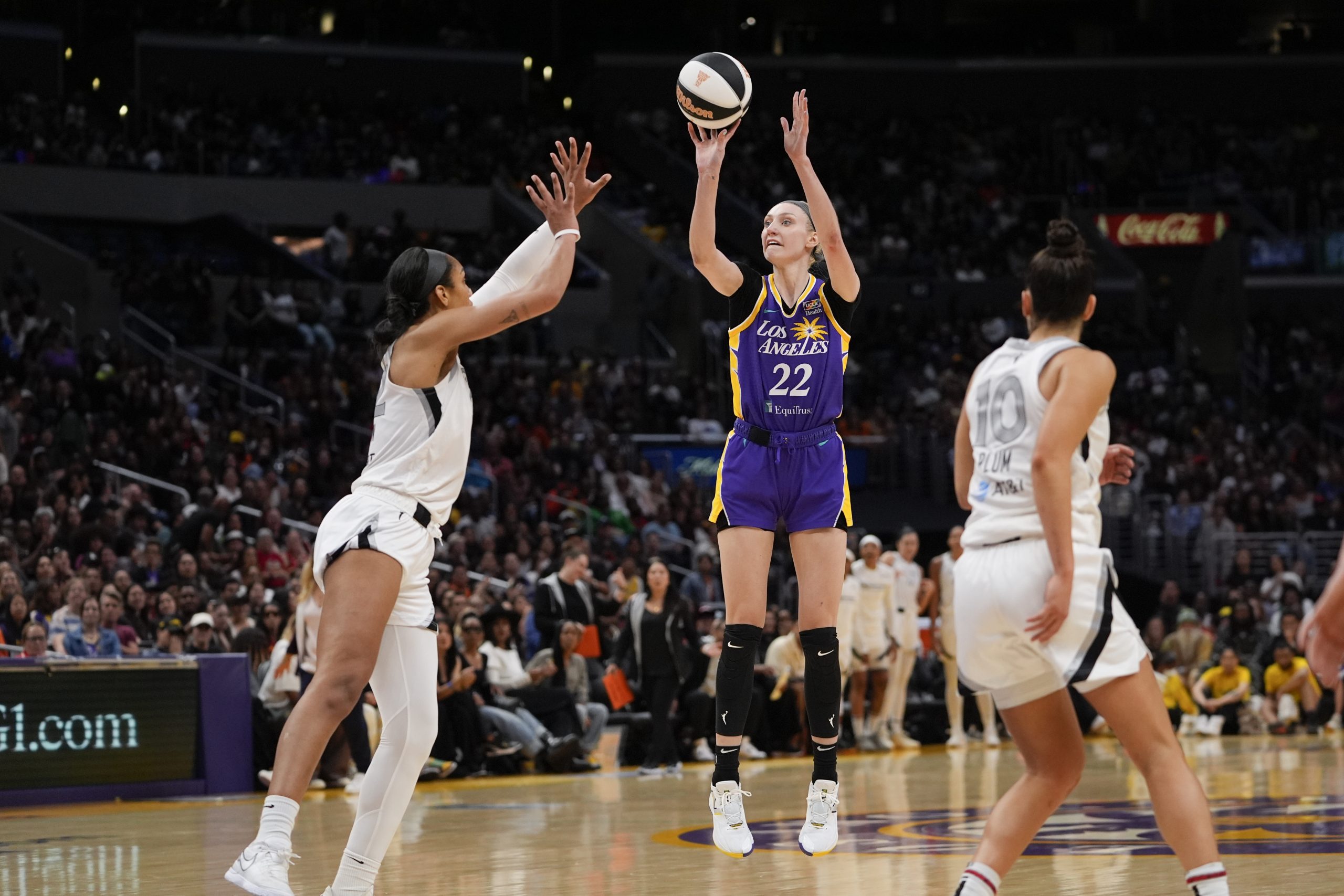 Los Angeles Sparks forward Cameron Brink shoots against Las Vegas Aces center A'ja Wilson.