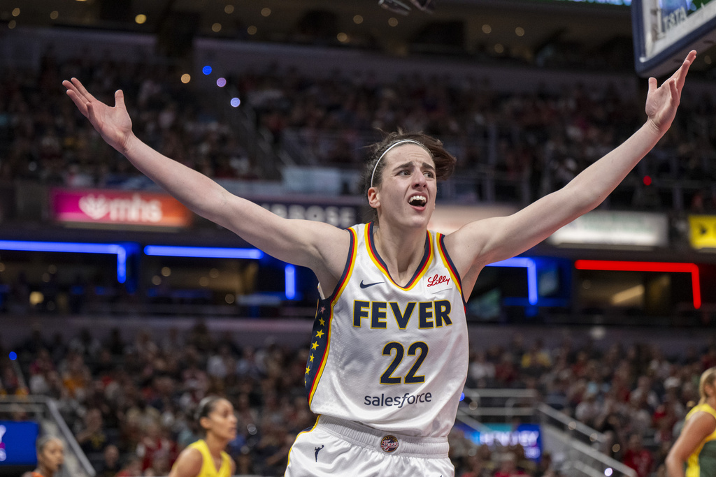 Indiana Fever guard Caitlin Clark reacts after scoring during a game.
