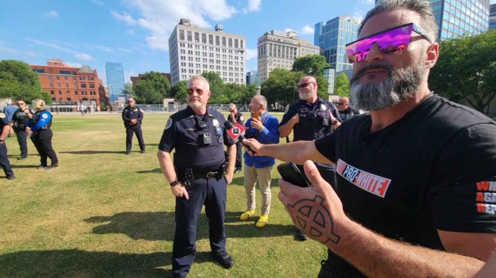 Minadeo Confronts Police.jpg