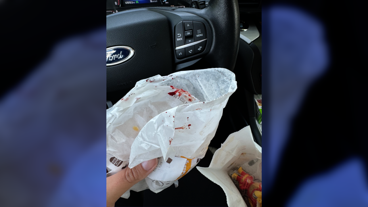 This is a photo of Tiffany Floyd's Burger King kid's meal order from the Getzville location. You can see what looks to be blood on the burger bag.