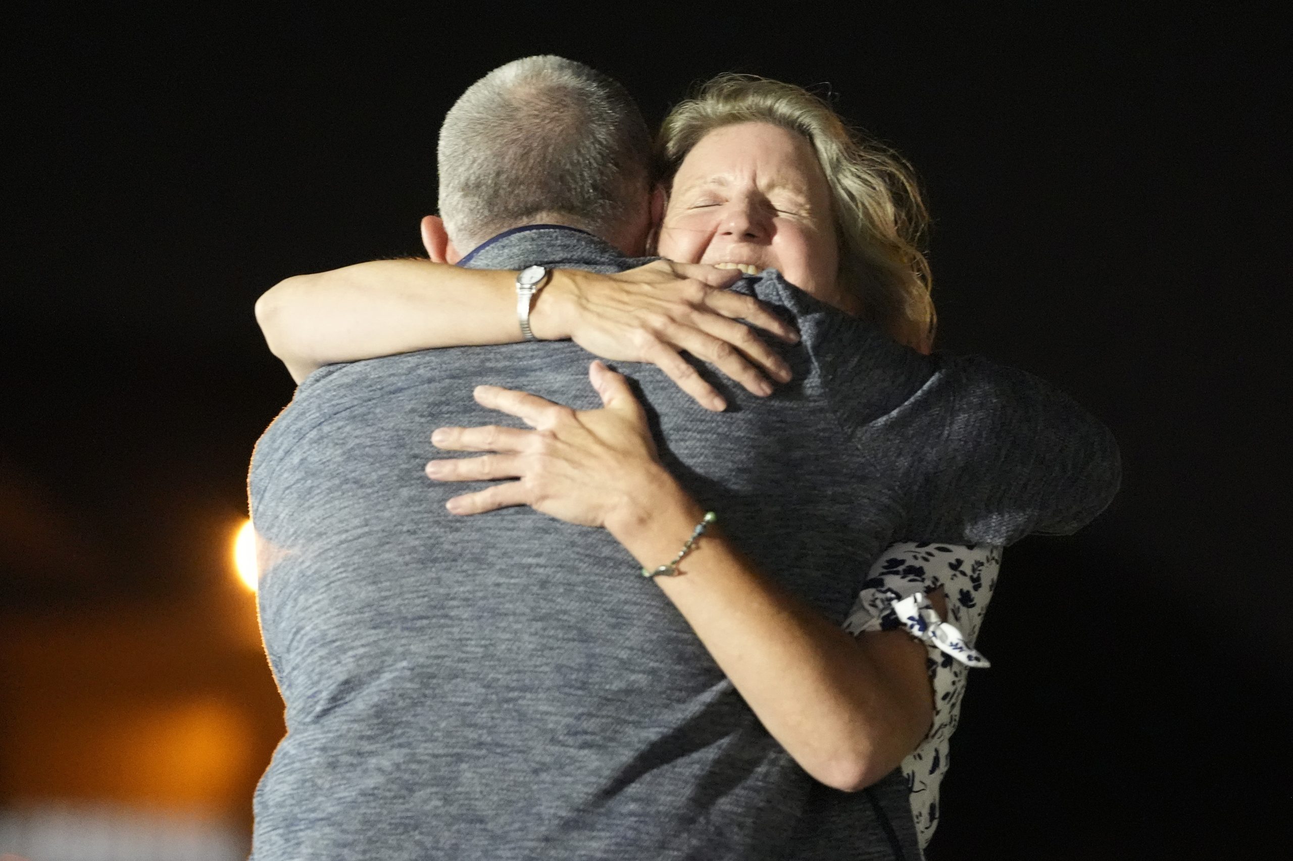 Elizabeth Whelan, right, hugs her brother Paul Whelan at Andrews Air Force Base in Maryland.