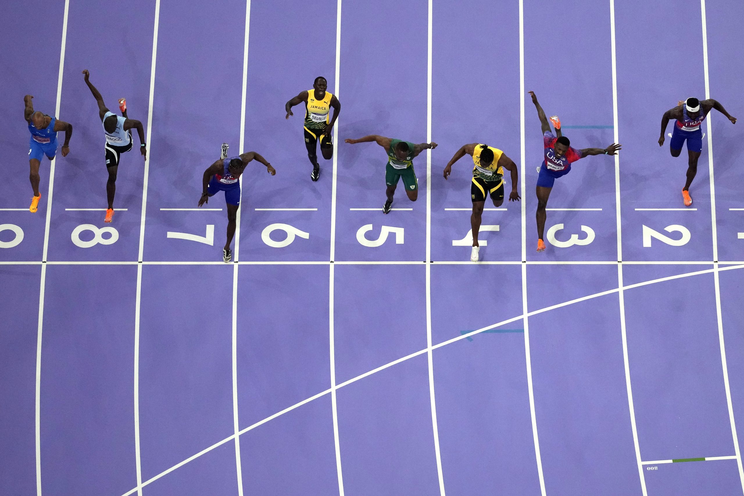 Noah Lyles, in lane seven, wins the men's 100-meter final at the 2024 Summer Olympics.