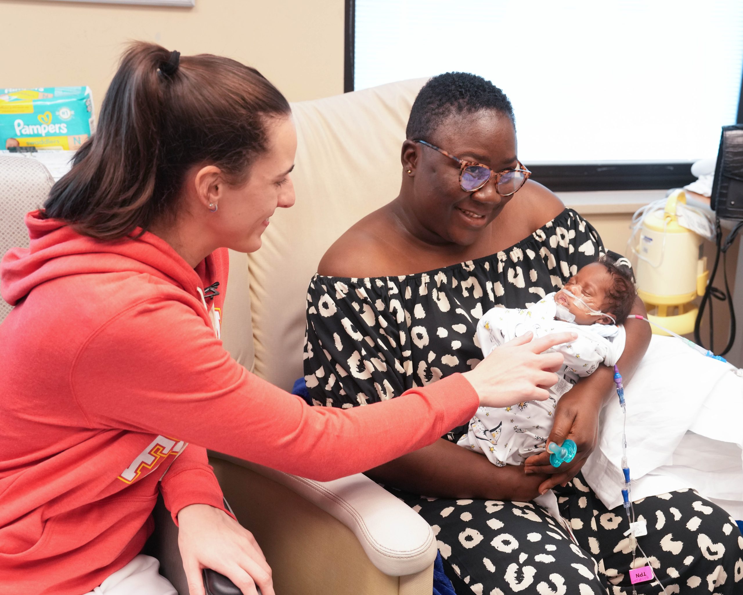 Caitlin interacts with baby Heaven.jpg