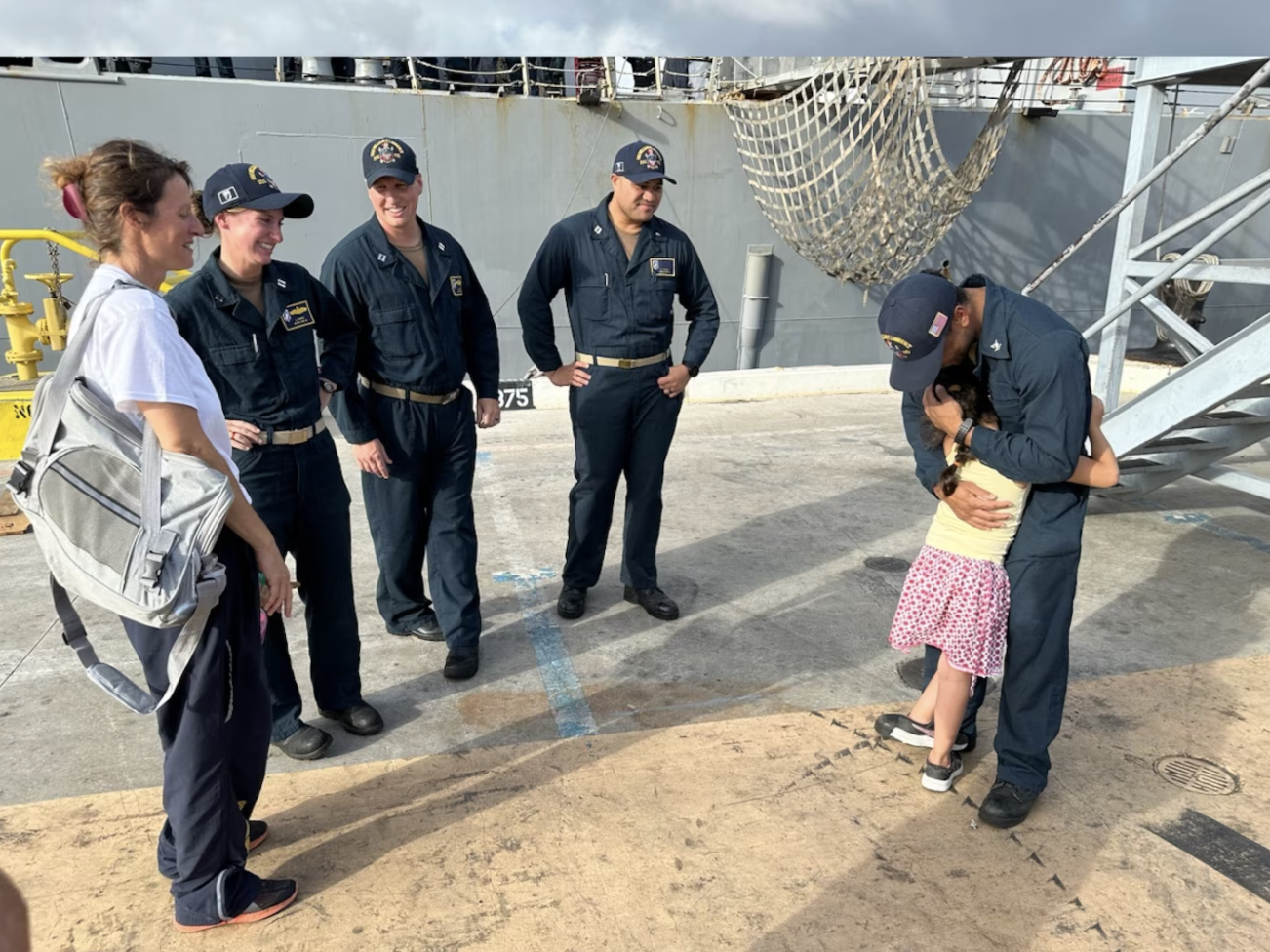 Crew provides comfort for 7-year-old rescued from sailboat.