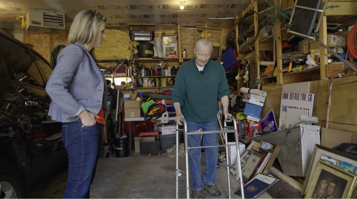 Carl Nelson shows Scripps News the walker he was given in the hospital after the attack.