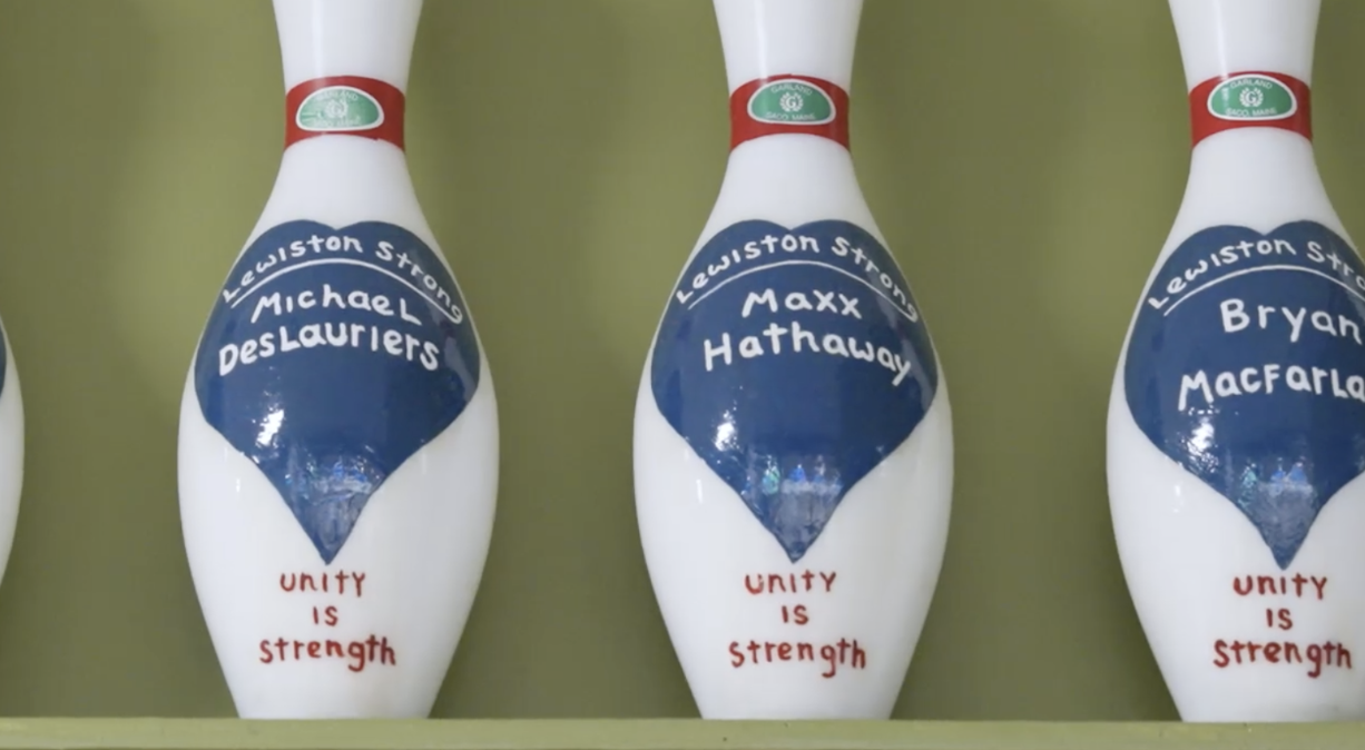 Memorial pins at Just-In-Time Recreation honor everyone killed in the Lewiston mass shooting. 