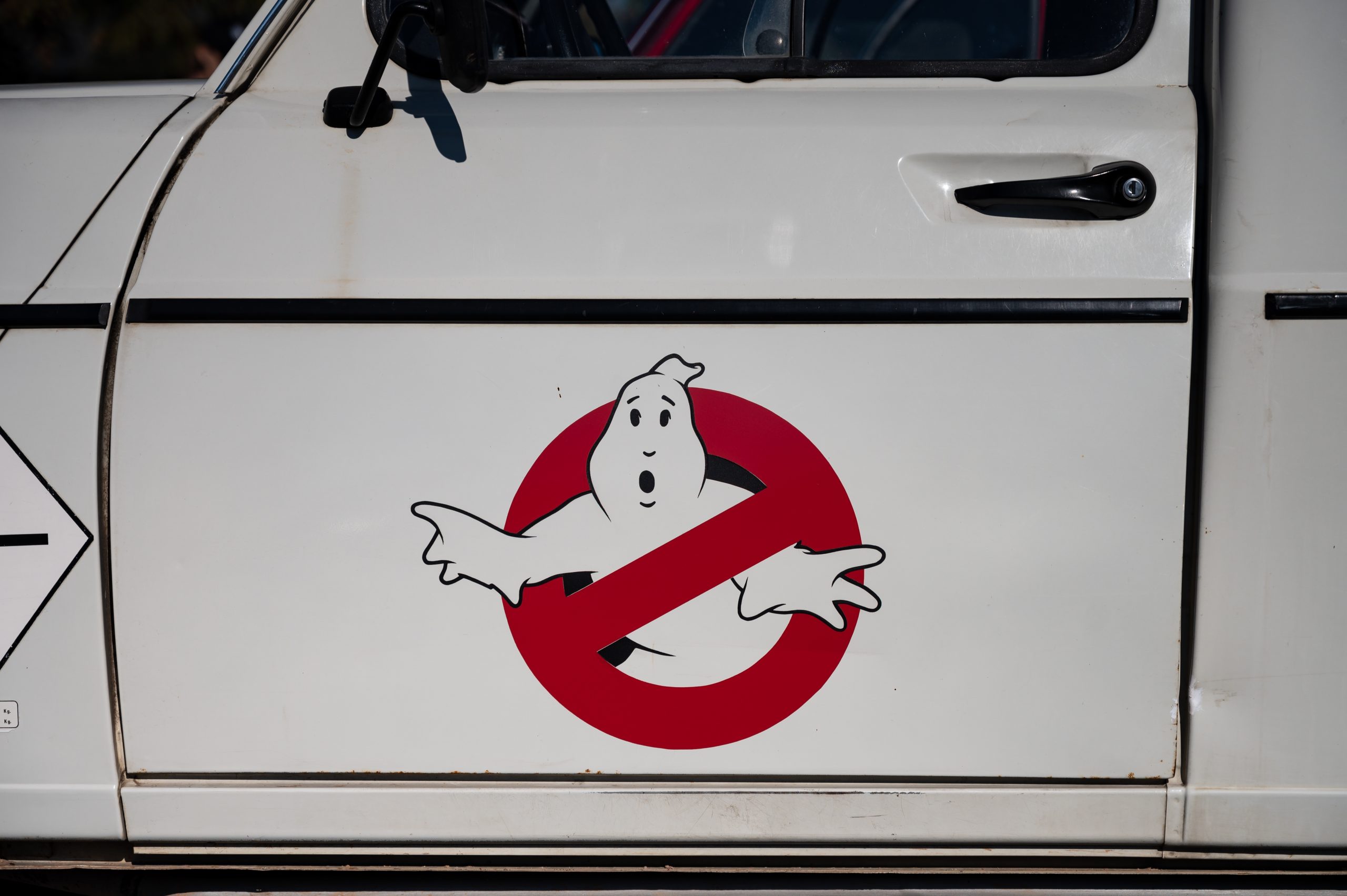 Ghostbusters symbol on a vehicle door.