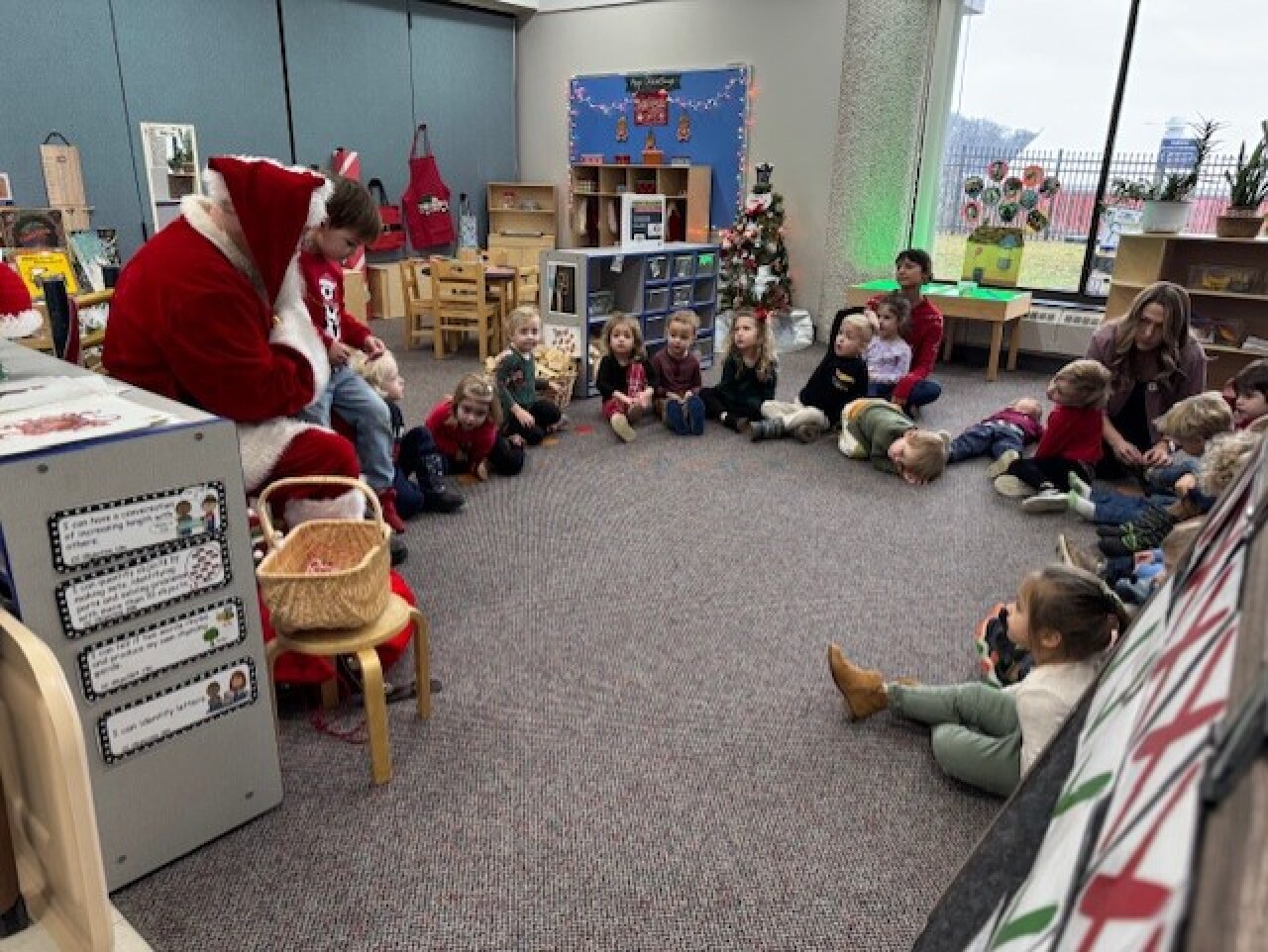 Garret Veihl — dressed as Santa Clause — speaks to a class of Michigan preschoolers.