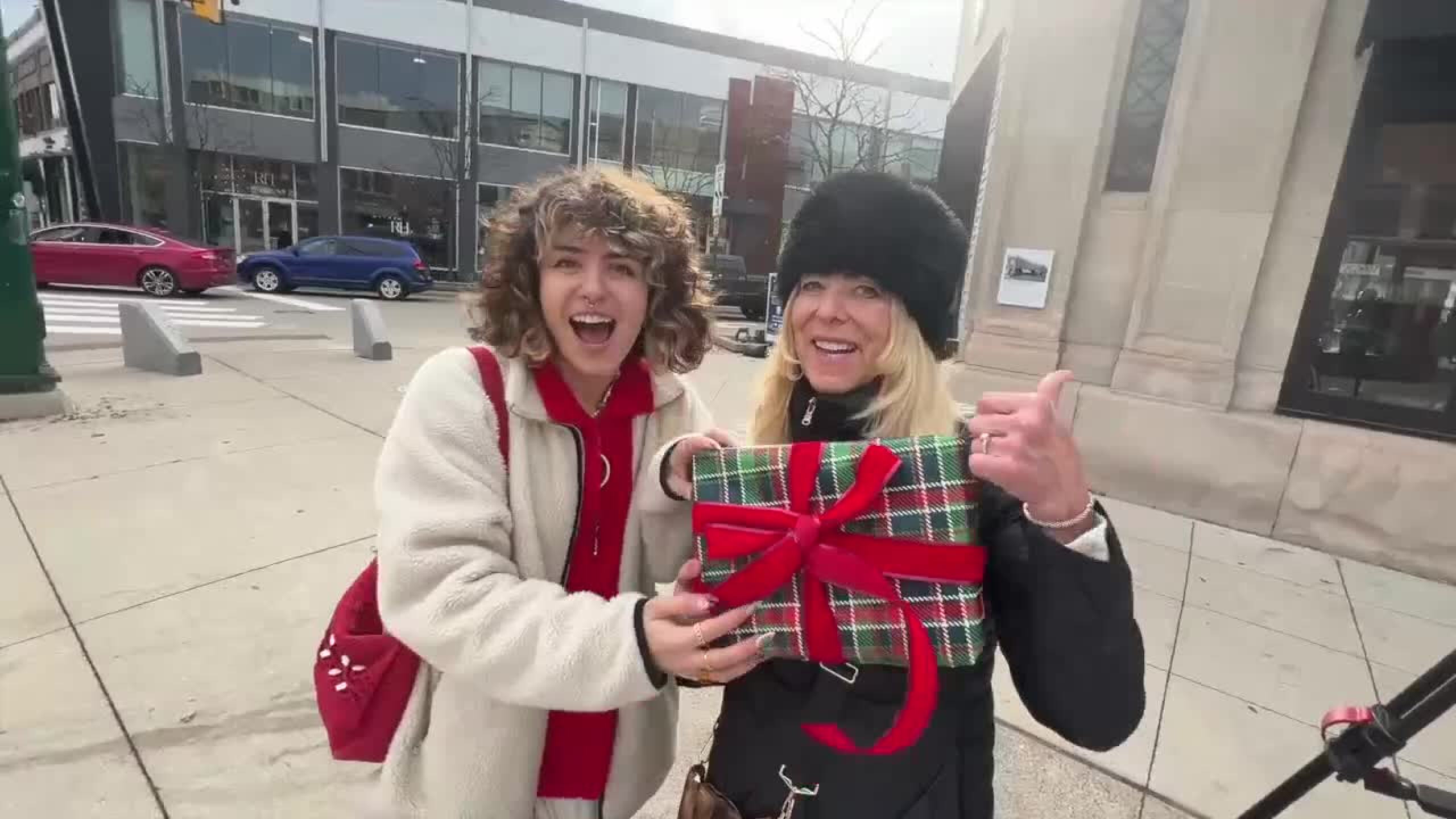 Jane and Sophia Gunterman pose with a gift they wrapped.
