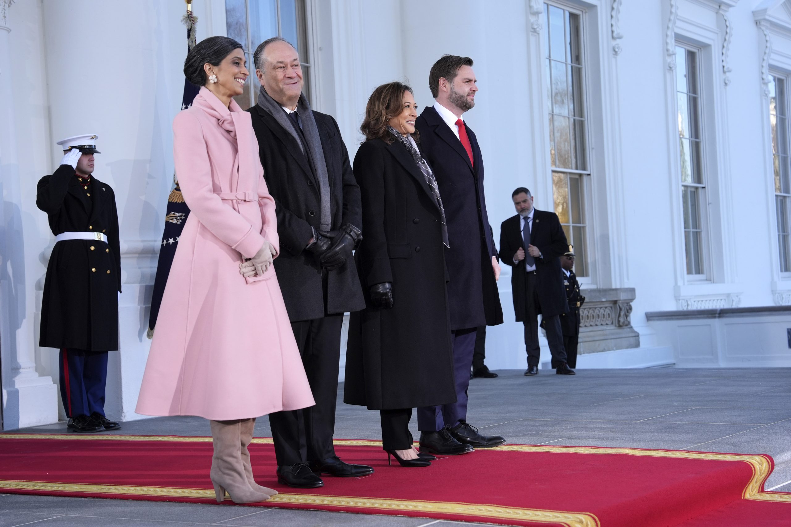 Vice President Kamala Harris, center right, and second gentleman Doug Emhoff, center left, pose with Vice President-elect JD Vance, right, and his wife Usha Vance, left, upon arriving at the White House, Monday, Jan. 20, 2025, in Washington.