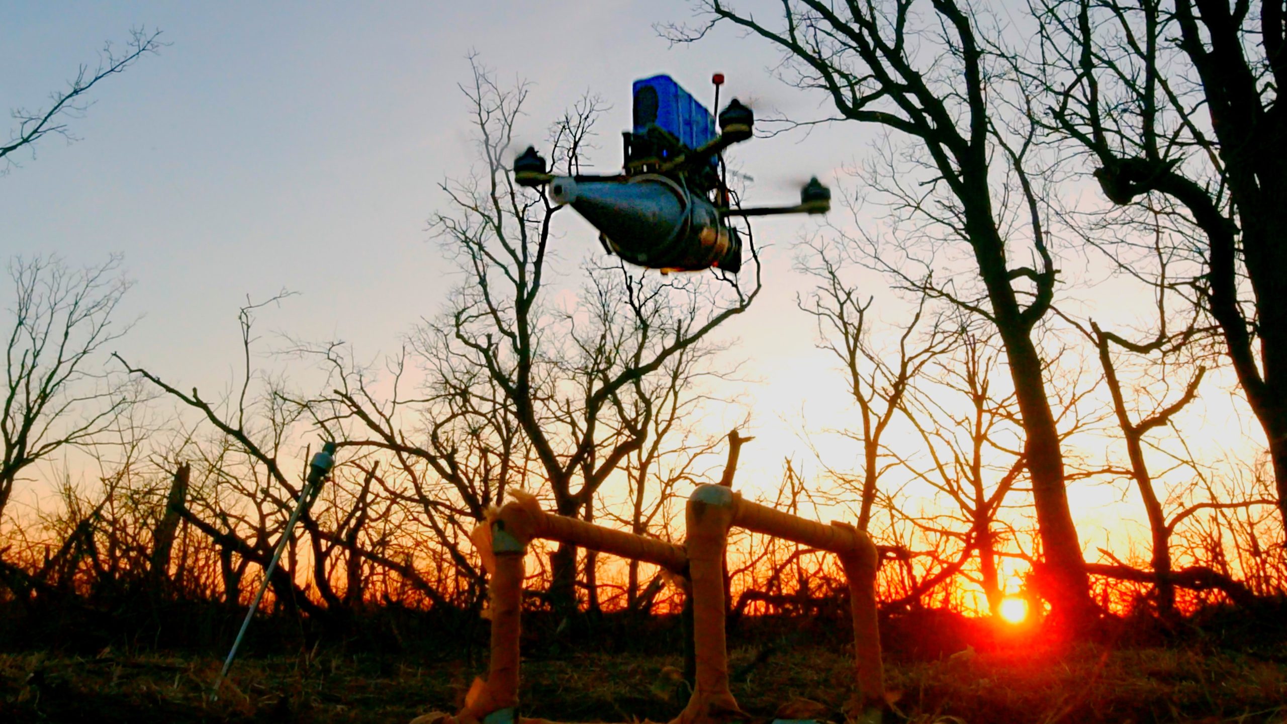 Drone taking off during sunset.