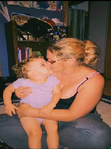 Judah Morgan and his foster mother Jenna Hullett.  Judah died in October 2021 after suffering blunt force trauma.  His birth parents were charged in connection with Judah's death.