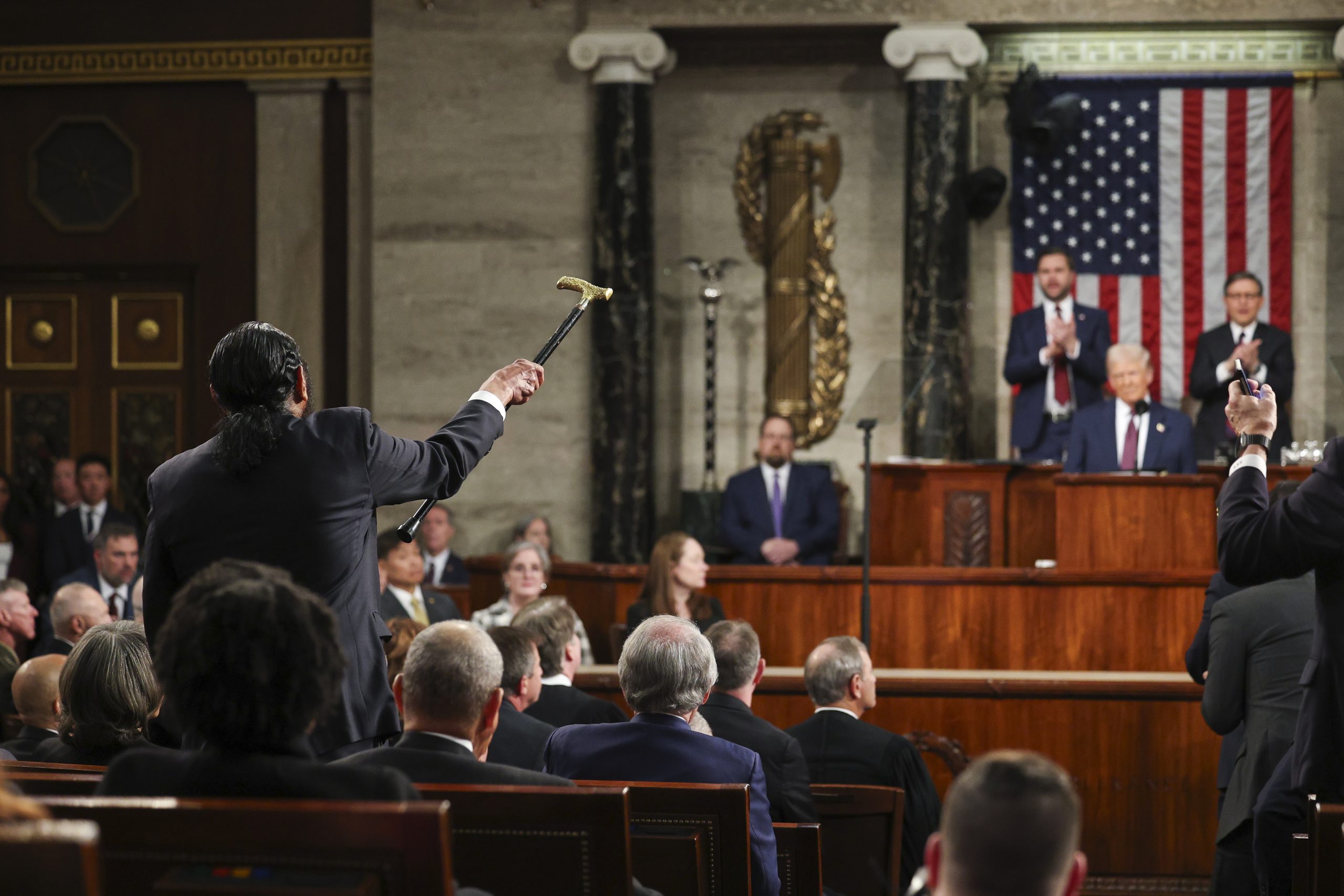 Rep. Al Green, D-Texas, left, shouts as President Donald Trump addresses a joint session of Congress at the Capitol in Washington, Tuesday, March 4, 2025. 