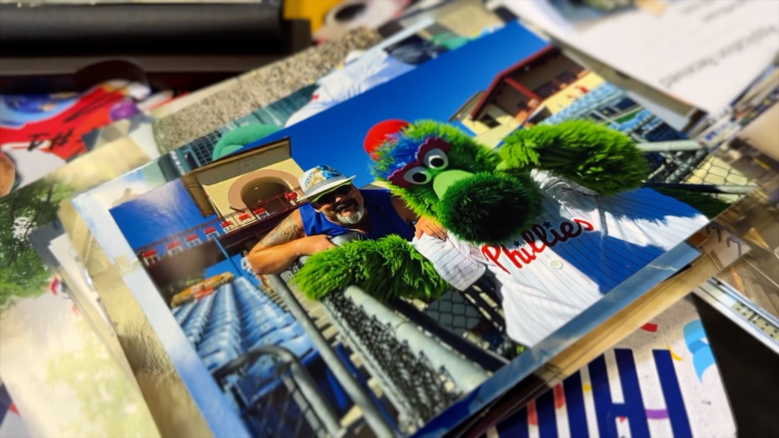 Photo of Tod Stutzman posing with Philadelphia Phillies mascot Phillie Phanatic.