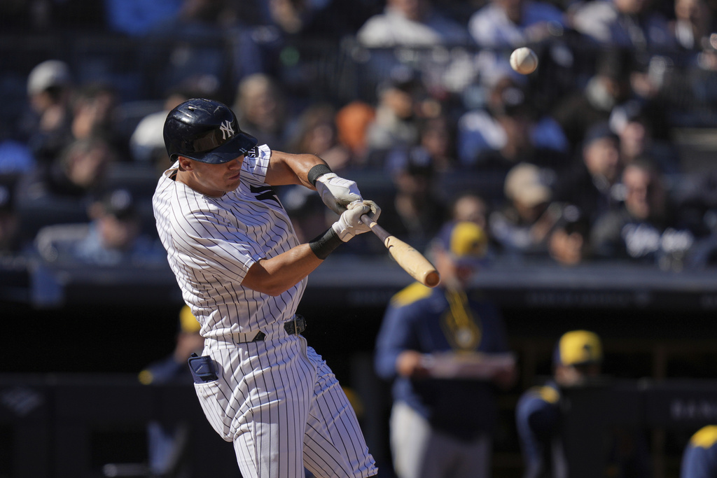 New York Yankees' Anthony Volpe hits a solo home run during the second inning a baseball game against the Milwaukee Brewers at Yankee Stadium.