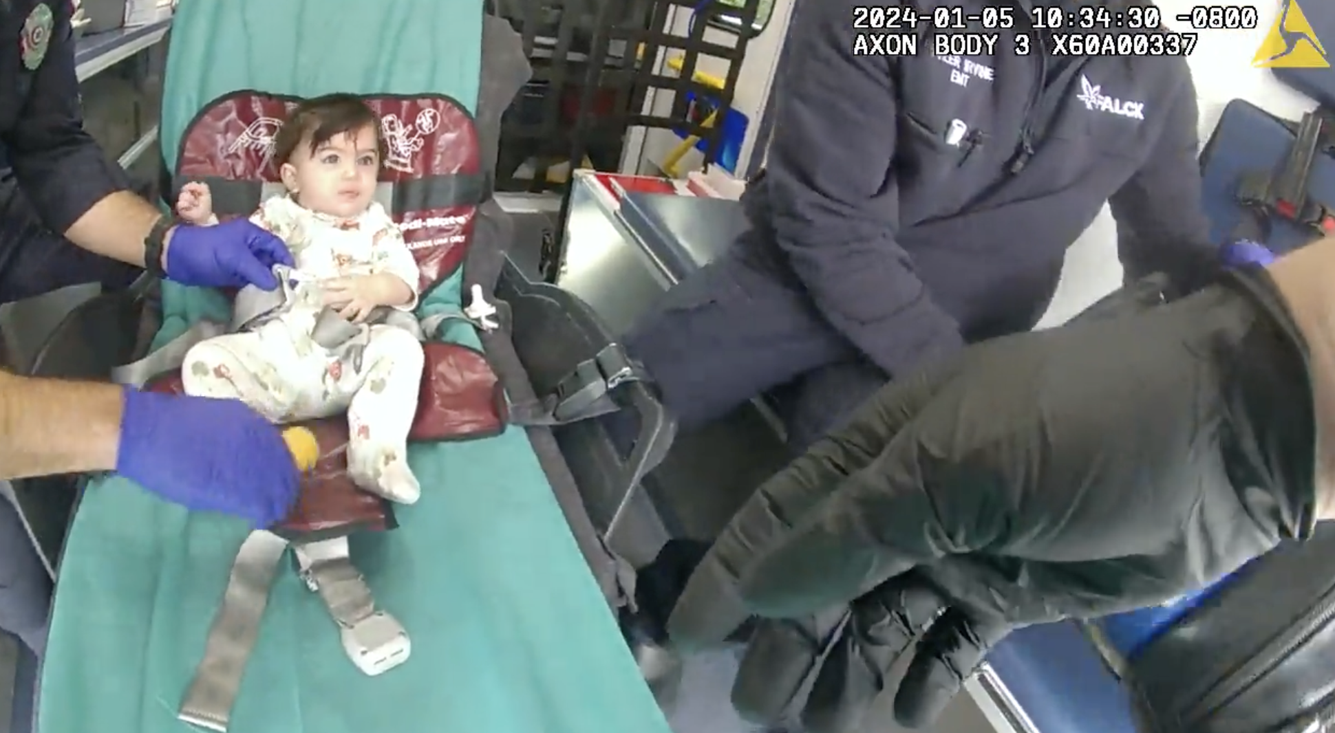 First responders treat a child in an ambulance for exposure to fentanyl