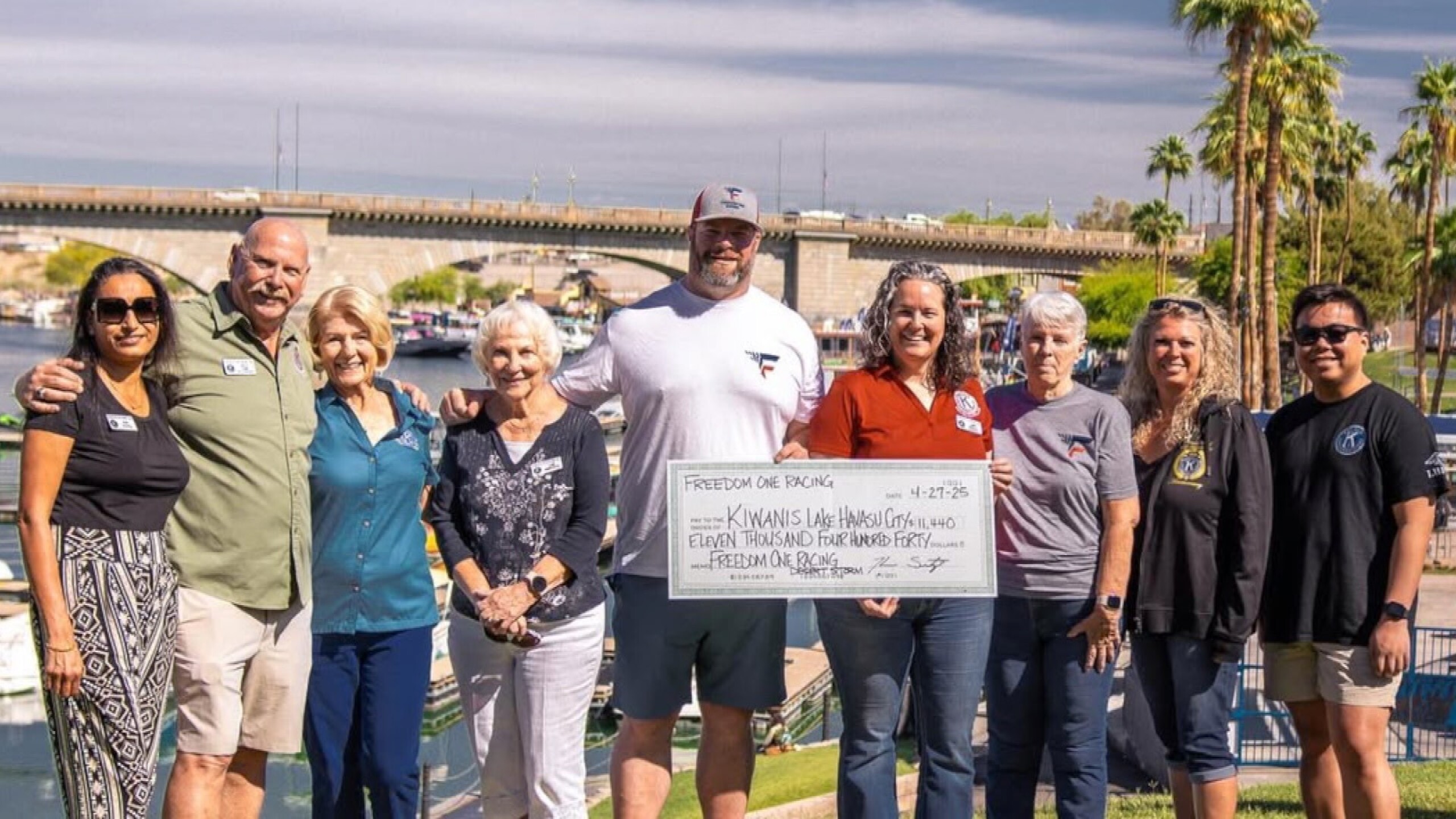 Freedom One Racing presents a check for charity.