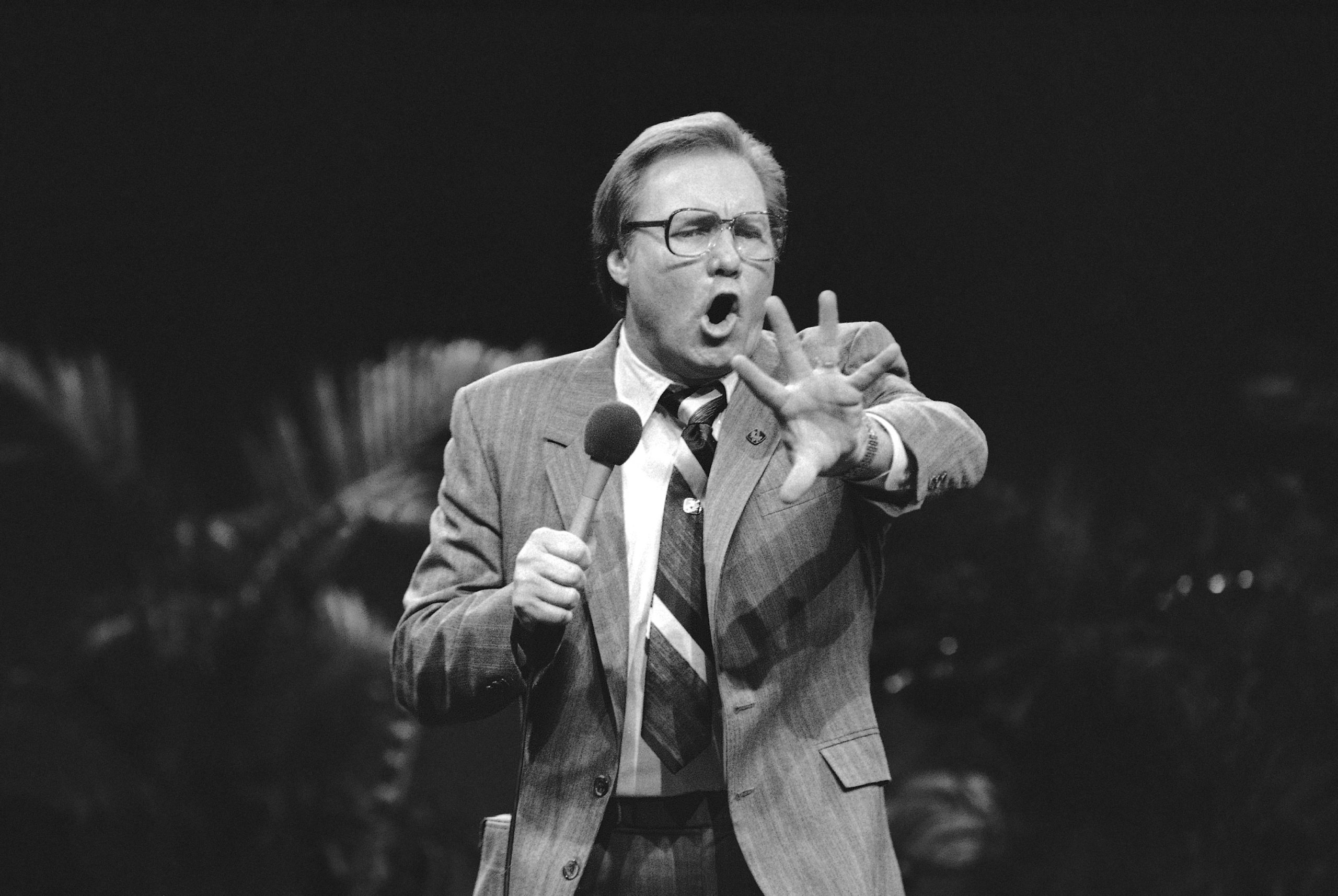 Members of the audience react to evangelist Jimmy Swaggart during a rally in Milwaukee, Feb. 10, 1985.