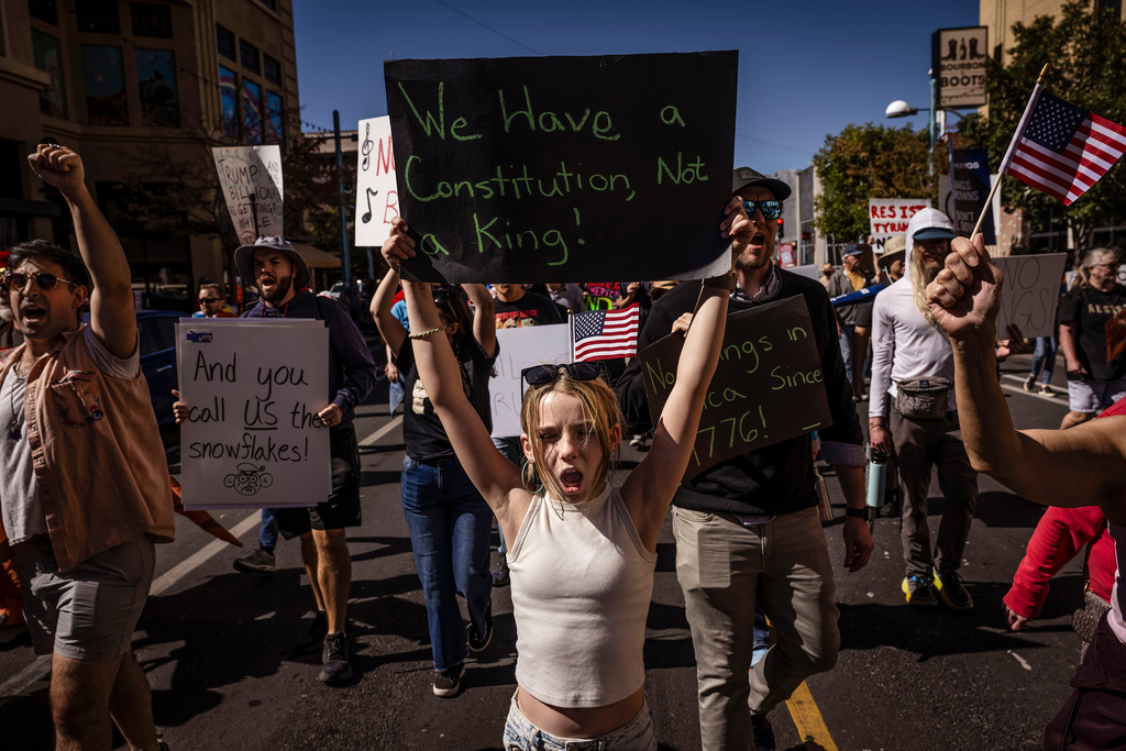 Daniella Diener participates with other protesters in the "No Kings" rally and march in downtown Albuquerque, N.M., on Saturday, Oct. 18, 2025.