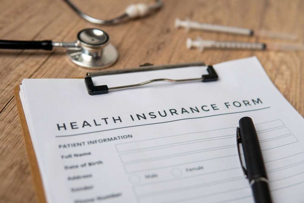 A,Close-up,Image,Of,Health,Insurance,Form,On,A,Clipboard.