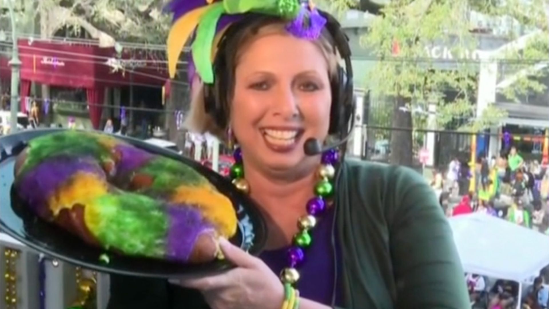 Kelly Schulz, senior vice president of communications and public relations for New Orleans & Company, poses with a King cake during Mardi Gras celebrations.